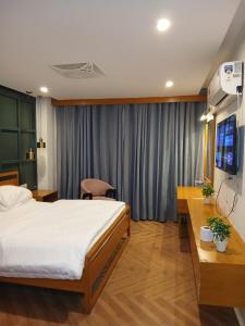 Postel nebo postele na pokoji v ubytování Grande apartments