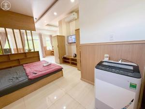 Postel nebo postele na pokoji v ubytování Nova Hotel Vũng Tàu