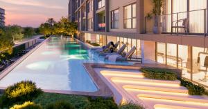Ban Thalat Choeng ThaleにあるSpace Cherngtalay Condo in Elegant Bang Taoのプールのある建物の外観を描いたアーティストのレンダリング