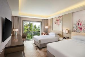 Letto o letti in una camera di Sheraton Bandung Hotel & Towers