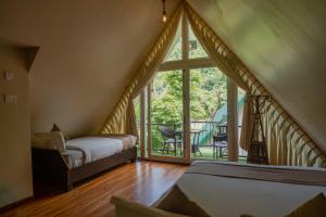 Postel nebo postele na pokoji v ubytování Trishuli Villa + 47 fotografií