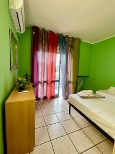 Postel nebo postele na pokoji v ubytování Bnbook - Ferrarin Apartment