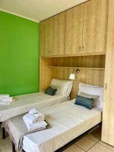 Postel nebo postele na pokoji v ubytování Bnbook - Ferrarin Apartment