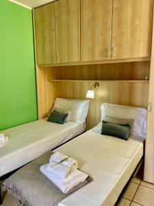 Postel nebo postele na pokoji v ubytování Bnbook - Ferrarin Apartment