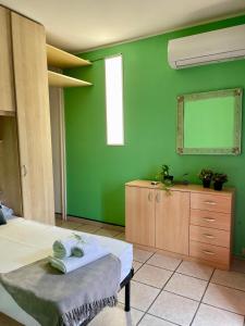 Postel nebo postele na pokoji v ubytování Bnbook - Ferrarin Apartment
