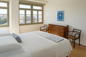 Postel nebo postele na pokoji v ubytování Grand Hotel Torre Fara