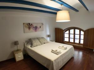 a bedroom with a bed with a blue ceiling at Living Valencia Peydro in Valencia