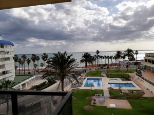 a view of the ocean from the balcony of a resort at Aloha 1º linea playa Benalmadena in Benalmádena