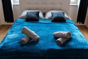 A bed or beds in a room at Royal Aurora Suite