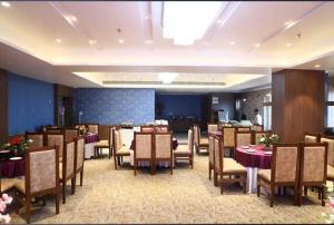 a large dining room with tables and chairs at Hotel Beatific Epsilon in Delhi
