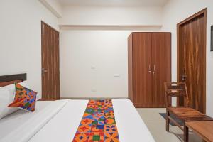 Postel nebo postele na pokoji v ubytování FabHotel Urban Villa