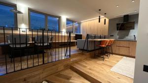 a kitchen and dining room with a table and chairs at Casa Lucia in Valdidentro +37 photos