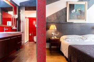 Ένα ή περισσότερα κρεβάτια σε δωμάτιο στο Boutique Hotel Scalzi - Adults Only
