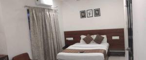 Postel nebo postele na pokoji v ubytování Hotel O Mysore Zoological Park Formerly Queens Comfort