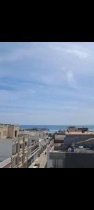 a view of the ocean from a balcony of a building at Dar Kelesh in Kelibia