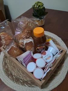 a basket of bread and food on a table at Lo SCRIGNO in San Giorgio Montagna +5 photos