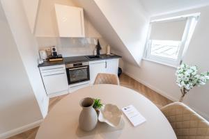 Kuchyň nebo kuchyňský kout v ubytování ViertelGlanz - Smart-TV, stilvoll & citynah wohnen + 7 fotografií