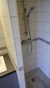 a bathroom with a shower with a glass door at Valcros Paradis in La Londe-les-Maures