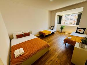 Ένα ή περισσότερα κρεβάτια σε δωμάτιο στο Luxury rooms ideal for tourists, ideal to visit Lisbon!