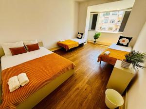 Ένα ή περισσότερα κρεβάτια σε δωμάτιο στο Luxury rooms ideal for tourists, ideal to visit Lisbon!