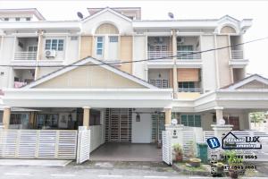 a large white house with a white fence at Jambul Residence 15 in Gua Sai