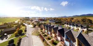 an aerial view of a village with houses and a street at Apartman 343 - Aquapark Tatralandia, Holiday village in Liptovský Mikuláš