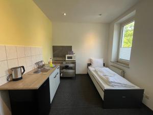 MonteurzimmerKING Leipzig-West 주방 또는 간이 주방