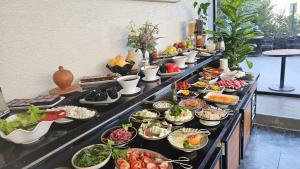 a buffet line with many different types of food at Educity Hotels & Spa in Istanbul
