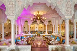 a rendering of the lobby of a hotel with a chandelier at Pickalbatros Palace - Aqua Park Hurghada in Hurghada +177 photos