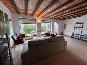 a living room with a couch and chairs at Somianatura - Casa Rural Capafonts in Capafons