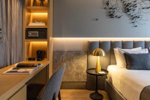 Posteľ alebo postele v izbe v ubytovaní Heritage Hill Hotel