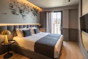 Posteľ alebo postele v izbe v ubytovaní Heritage Hill Hotel