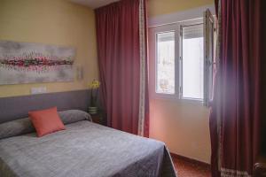Postel nebo postele na pokoji v ubytování Hotel Paraíso