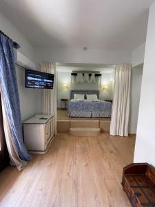 Postel nebo postele na pokoji v ubytování Great Greece Le Convivial Suites