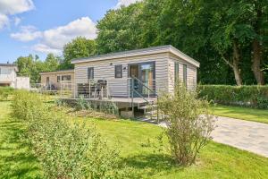 En have udenfor Ostseecamp Ferienhaus Dünenglück