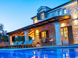 a house with a pool in front of it at NEW 2023 Villa Tree of Life in Sveti Petar