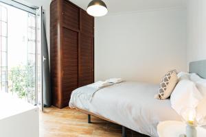Posteľ alebo postele v izbe v ubytovaní Peral Suite Sevilla