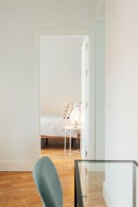 Posteľ alebo postele v izbe v ubytovaní Peral Suite Sevilla