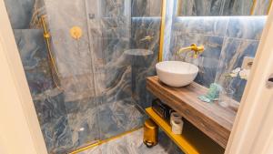 a bathroom with a sink and a shower at Suite Sirmione Studio - Italian Homing in Sirmione
