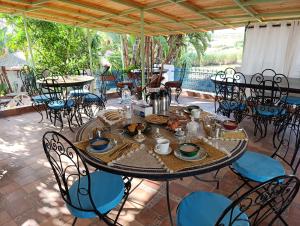 a table and chairs on a patio at daryemma2 in Asilah