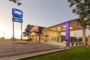a store front with a sign in front of it at Capital O Route 66 Country Inn Vega Tx in Vega