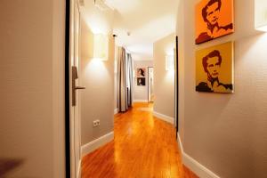 a hallway with a hallway leading to a room at Hotel Victoria in Frankfurt