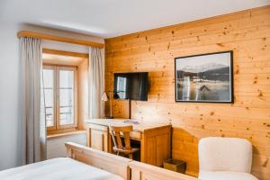 TV a/nebo společenská místnost v ubytování Hôtel de Commune - Rougemont