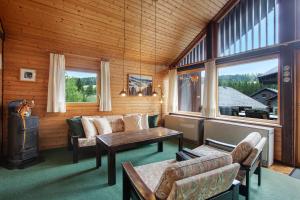 a living room with a couch and a table at Haus 7 Bernau in Bernau im Schwarzwald