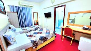 Postel nebo postele na pokoji v ubytování Al Arraf Hotel
