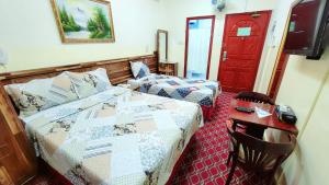 Postel nebo postele na pokoji v ubytování Al Arraf Hotel