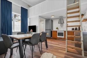 a kitchen and dining room with a table and chairs at Berg Apartments in Reykjavík