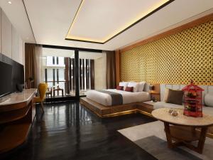 Grand Seminyak Lifestyle Boutique Bali Resort客房内的一张或多张床位