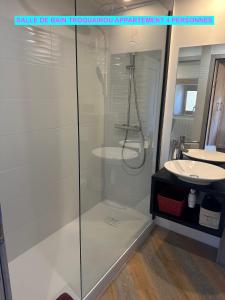 a glass shower in a bathroom with a sink at MAISON DES VIGNES- TROQUAÏROU et BECCA MOTTA in Brides-les-Bains +17 photos