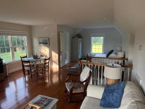 a living room with a couch and a table at Serenity in White Stone